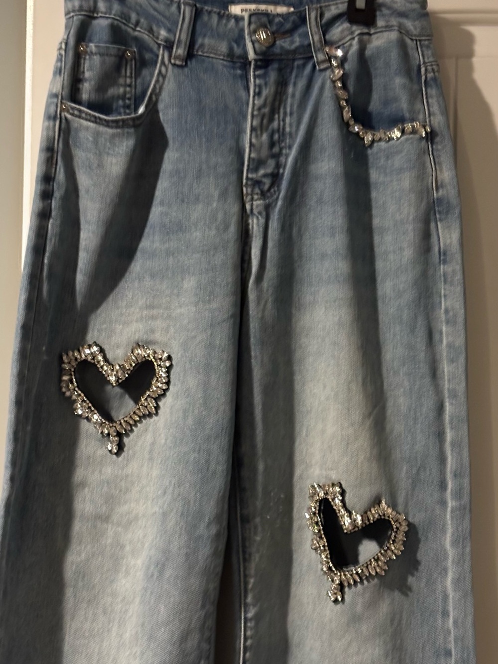 Light Wash Wide-Leg Jeans with Crystal Heart Embellishments.
